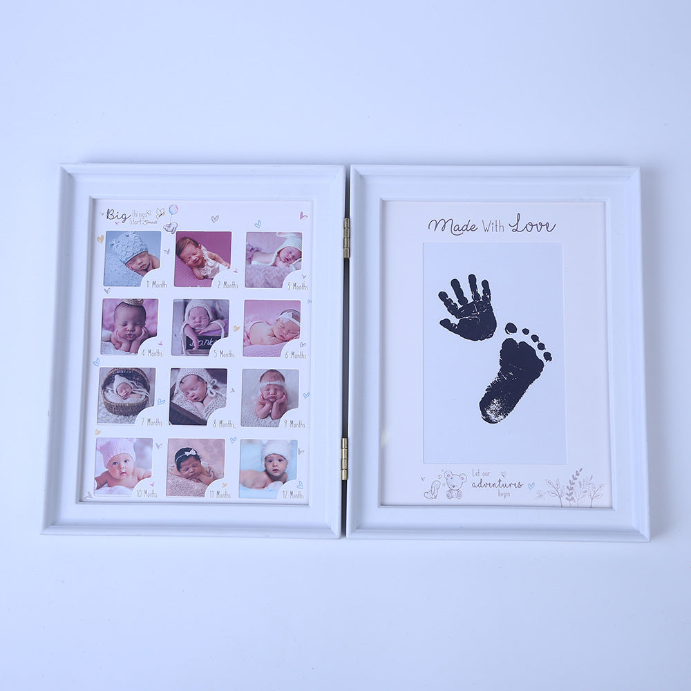 Newborn hand and foot print mud